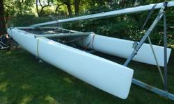 This Nacra is in great condition. The hulls were recently removed from the cross braces and repainted and the trampoline was replaced, the standing rigging has been replaced and improvements were made to the steering and rudder system. The sails; however,