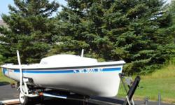 Excellent condition, like new, with trailer and 4 hp Suzuki outboard motor, with "custom made canvas" to cover the boat. $3,500.00 ***The picture of the boat in the water with the sails are not my boat.*** I just want you to see a picture of the sails and