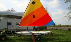 1980s 14 ft Sunfish with trailer. Good condition. Ready to teach you to sail or just have fun