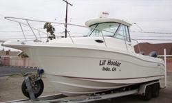 WOW ! TWIN 150HP FOUR STROKESFamilies that love to fish also love the 2601 Walk Around O/B. Standard features include a lighted bait tank, plenty of recessed rod storage, a self-bailing deck and a spacious V-berth with a galley, sink and stove. This 2601
