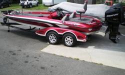 2006 Ranger Z21 Comanche Single Console Fiberglass Bass Boat. Powered with a 2006 Mercury 225HP Pro XS Direct Injection Outboard Motor. Motor is equipped with power trim operated in four different locations, directly on engine, gear shift lever, steering