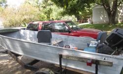 16 foot boat with motor and trailer. call russ 563-260-1521