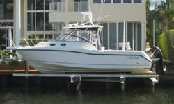 2005 Boston Whaler 305 CONQUEST The Boston Whaler 305 Conquest is the perfect combination boat capable of catching those big fish or an evening of cruising and just entertaining. This vessel has all the right features you could put on a 30 ft boat