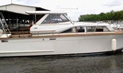 30 ft Trojan Sport Cruiser - perfect size for Trent system. Wide 11 ft beam, fiberglass hull, beautiful teak deck, walk around and swim platform with ladder. The combination of twin Mercruiser 215hp engines, low profile design, and a well balanced, mid