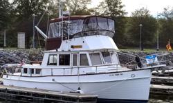 Entering the salon through the starboard side deck access door, you will find the lower helm starboard forward, the L-shaped settee and table starboard aft, galley port forward and a bench seat port aft. The master stateroom with ensuite head is aft and